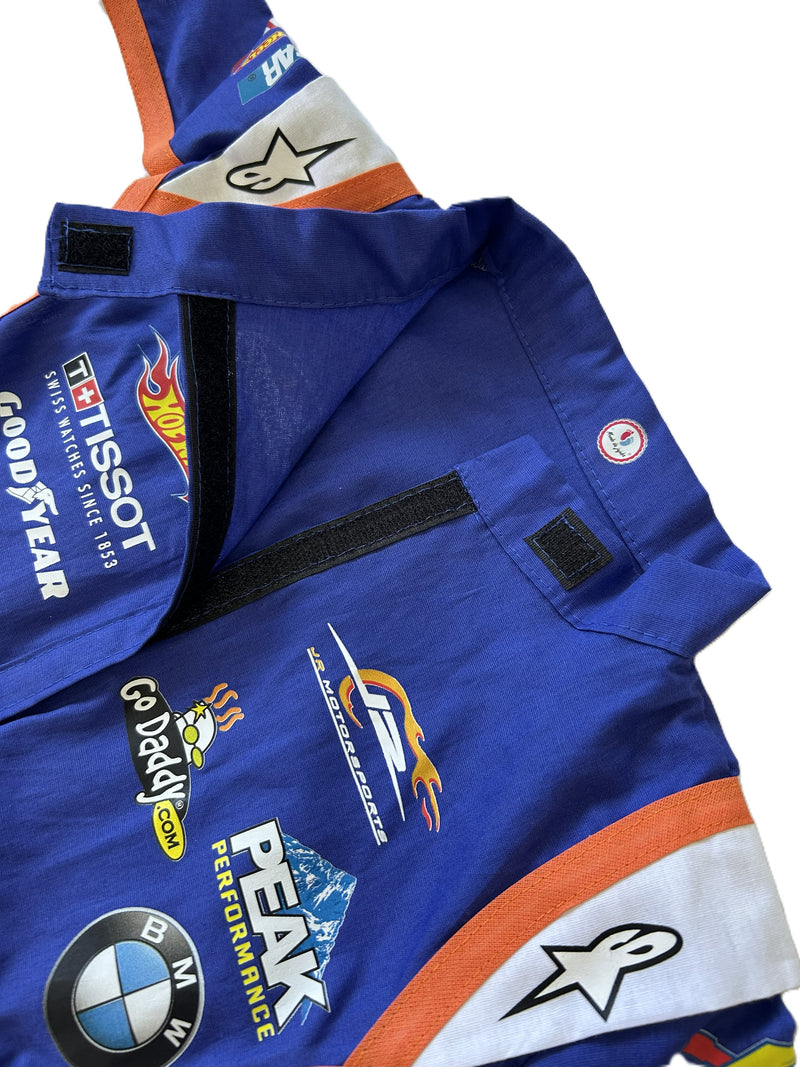 Macacão hotwheels Nascar com viés laranja curto infantil